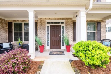 Entrance to property featuring covered porch and b