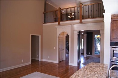 Catwalk overlooking living room, kitchen, and foyer
