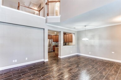 Unfurnished living room with crown molding, a chan