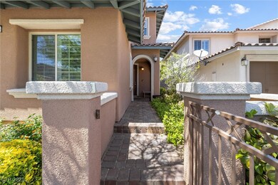 Entrance to property featuring stucco siding and a