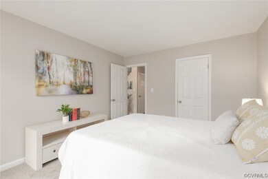 Carpeted bedroom featuring a closet