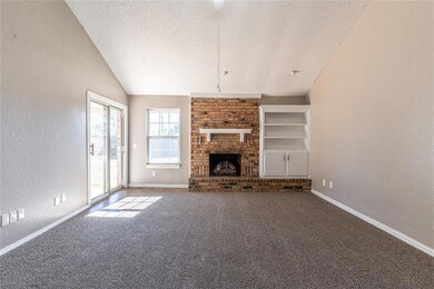 Unfurnished living room with a textured ceiling, a