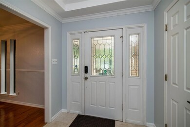 Beautiful paned window and front door in entry.