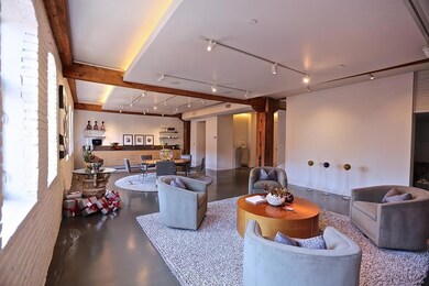 Living room with rail lighting, museum finished wa