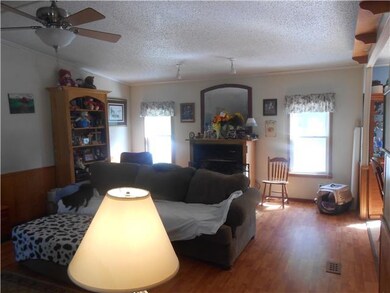 Opposite side of living room with gas logs.