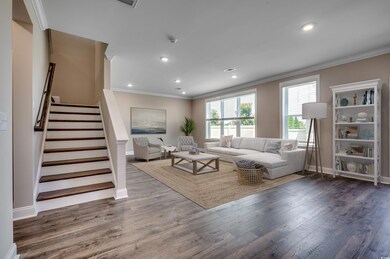 Living area featuring recessed lighting, stairway,
