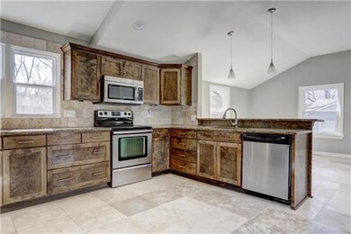 another view of the stunning kitchen and snack bar