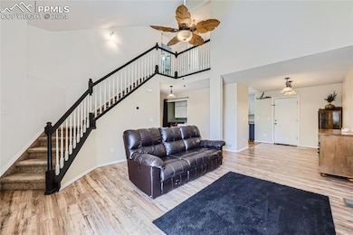 Living room featuring light wood-type flooring, a 