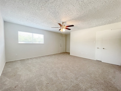 Third floor entry opens up to bedroom with private bathroom