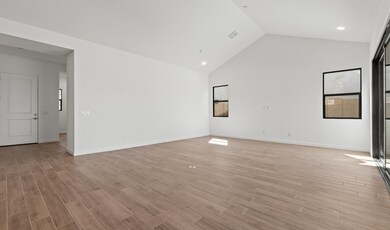 Open concept living spaces with vaulted ceiling