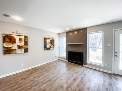 Unfurnished living room with wood finished floors