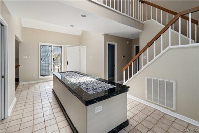 Foyer with light tile flooring