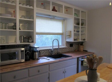 Updated kitchen with fresh paint, new butcher bloc