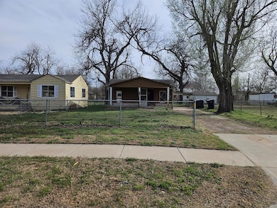Bungalow-style house with driveway, a fenced front