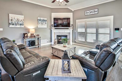 Living room featuring visible vents, dark wood-typ