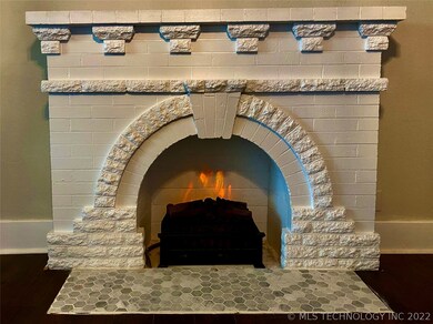 Faux fireplace with electric heat.
