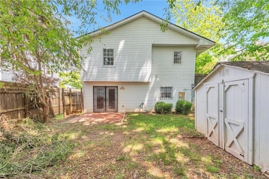 Rear view of property with a patio
