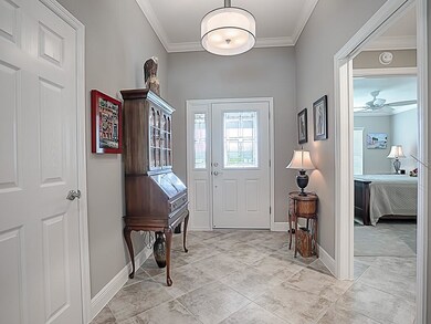 NICE FOYER WITH LEADED GLASS DOOR AND SIDE LITE. C