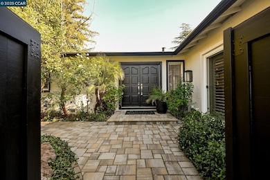 Custom Pavers from the driveway to the private front courtyard. Mature landscaping & fruit trees.