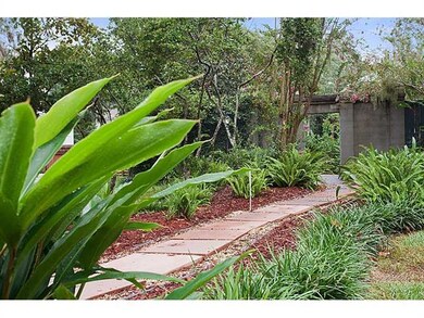 Garden. Gorgeous walkway & gardens behind a landsc