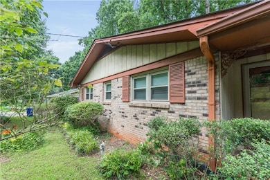 View of side of home with brick siding