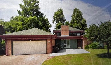 View of front of property featuring a garage and a