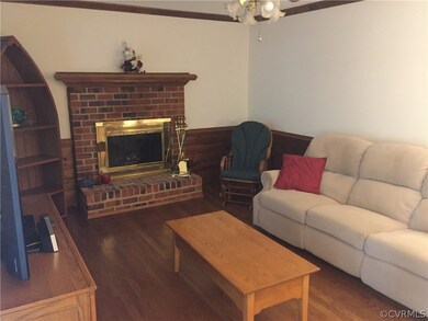 Family Room has Brick Wood Burning Fireplace.