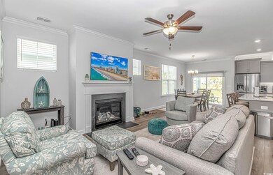 Living area with light wood-style flooring, visibl