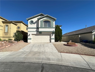 View of front of home featuring stucco siding, concrete driveway, and an attached garage