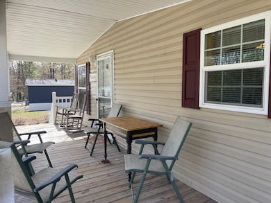 THE PORCH IS A DEFINITE HIGHLIGHT OVERLOOKING THE GRASSED FRONT YARD