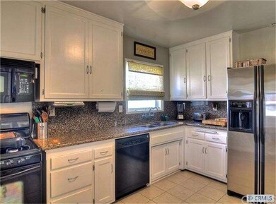 Redesigned kitchen with gas range, microwave hood 