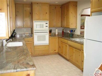 The kitchen has lots of light and vaulted ceiling 