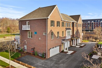Exterior side with additional parking and balcony off the master suite.