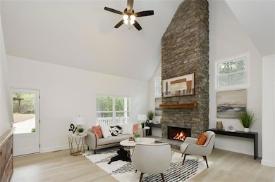 Stone fireplace living room with vaulted ceilings