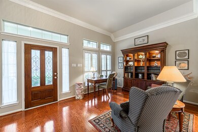 The front entry features a beautiful lead glass door & opens up to one of two living areas.