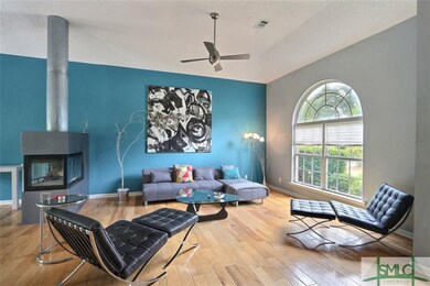 See through wood burning fireplace divides the gre