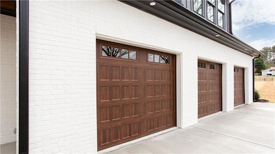 Garage featuring driveway