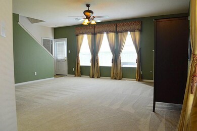 Large Family Room with amazing windows for natural lighting!