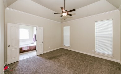 Tiled spare room with carpet, ceiling fan, and crown molding