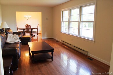 Living Room with wood flooring and plentiful natur