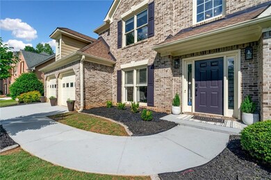 Entrance to property featuring concrete driveway, 