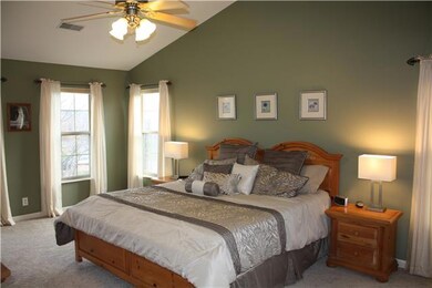 Master suite with vaulted ceiling and tons of natural light