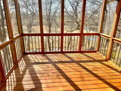 The other make over is the entire interior of the 3 season screen porch out back. This space has fantastic views of the of wildlife and the wetland area that hosts geese, swans and deer to name a few.
