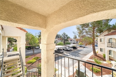 Covered porch with a residential view and stairs
