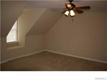 The upstairs back bedroom includes a nice window s