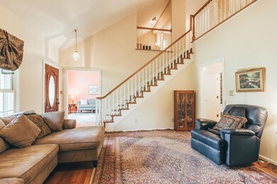 Front Entry and Great Room have soaring vaulted ceilings and beautiful hardwood flooring.