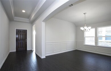 NEW CONSTRUCTION: Entryway and formal dining area