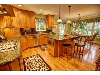 The chef's kitchen features extensive solid wood c