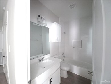Full bath with toilet, shower / bathtub combination, vanity, and visible vents
