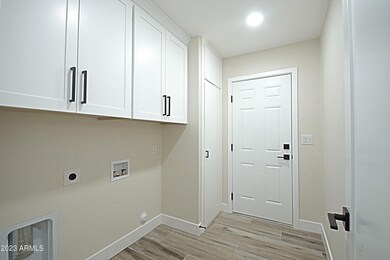 Laundry with storage cabinets